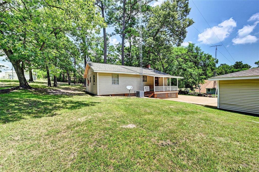 Back view of the property. Beautiful lot to the left in photo is included!