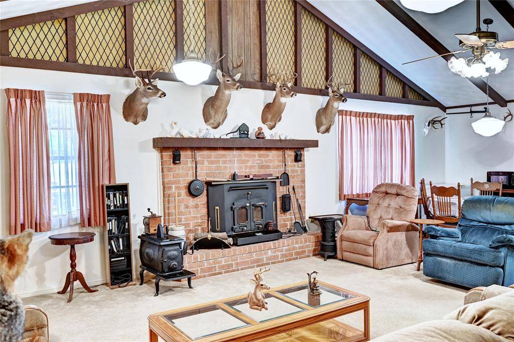 Take a look at this wood burning fireplace. Blower on the side give all the head you need on a cold winter night.