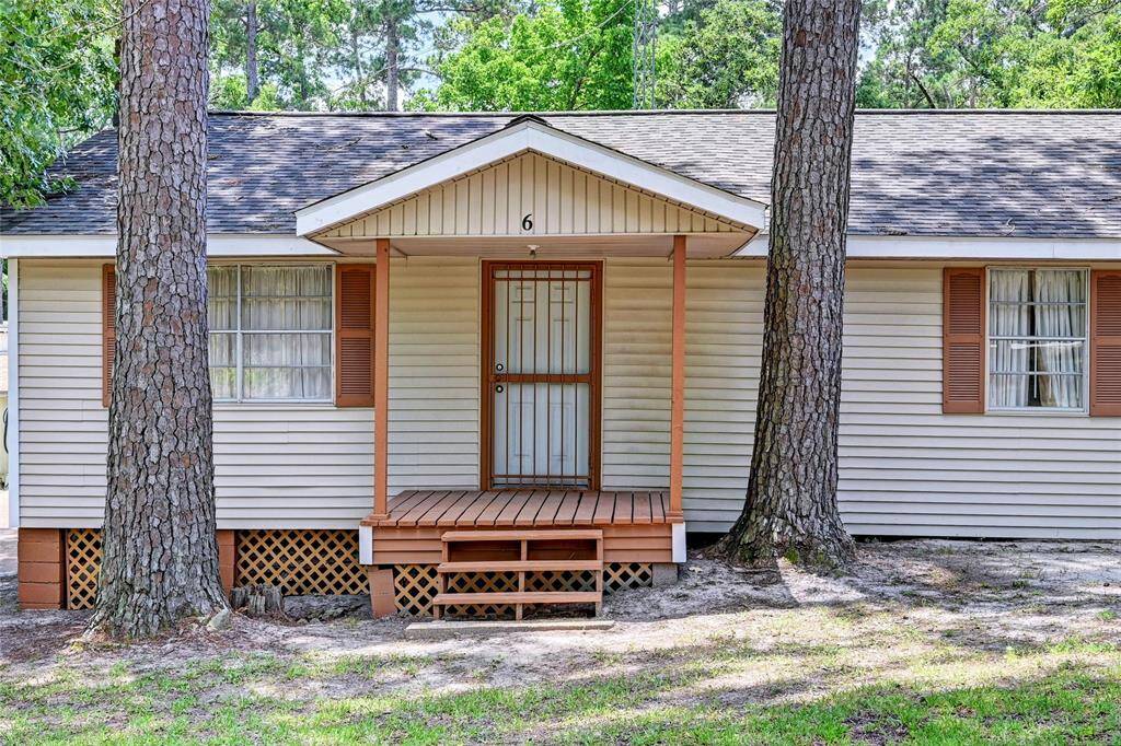 Front of home with covered entry.