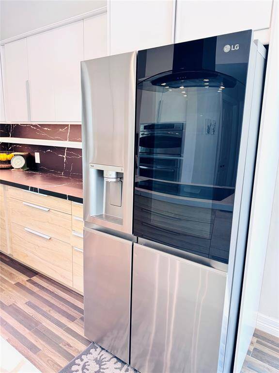This LG ThinQ Side-by-side Refrigerator conveys with the home with a full price offer!