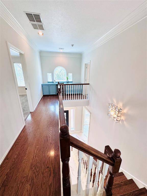 As you go upstairs, you will love the oak hardwood steps and bannister!