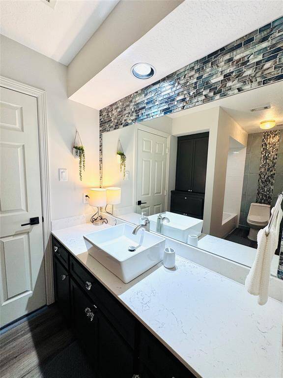 Bathroom #2 has been remodeled! It has an updated vessel sink, marble counter, and LVP Flooring!