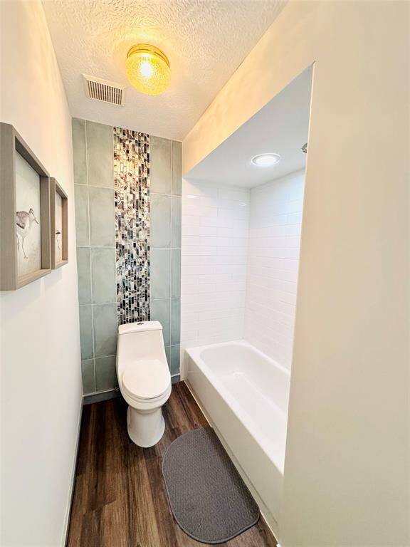 This tub/shower combo tile surround was updated as well!