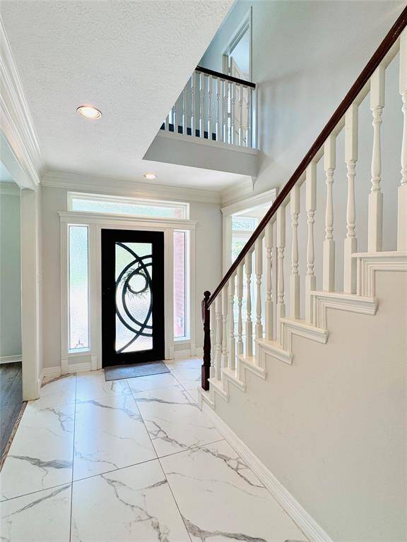 This light and bright space will welcome your guests every time you open the door!