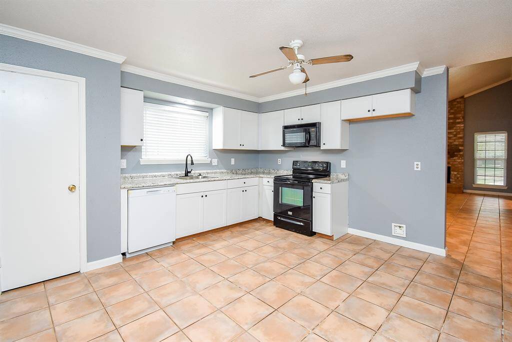 Expansive kitchen with adjoining breakfast nook.