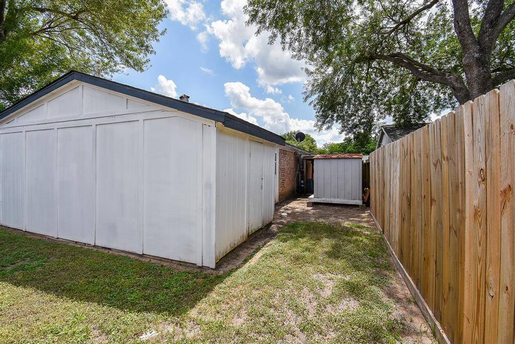 Enjoy the convenience of a side yard featuring a covered patio and an upgraded breaker box with generator hookup.