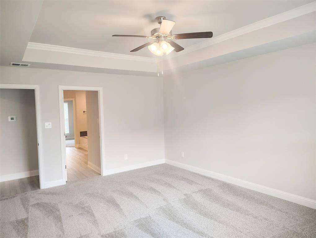 Primary Bedroom with Tray Ceiling Stock Photo