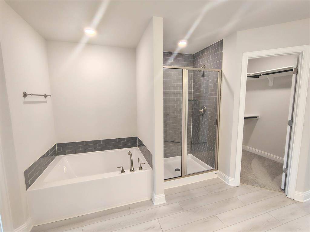 Primary Bath Spacious Shower and large garden soaking tub stock photo