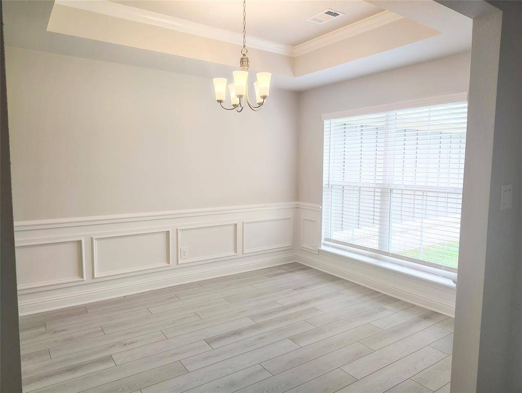 Formal Dining with Wainscoting and tray ceiling stock photo