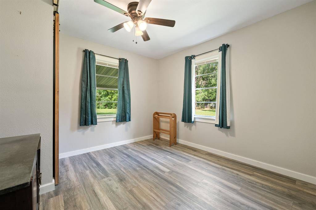 Seecond bedroom offers a lot of space, two windows, new fan, a sliding barn closet door and fantastic views!