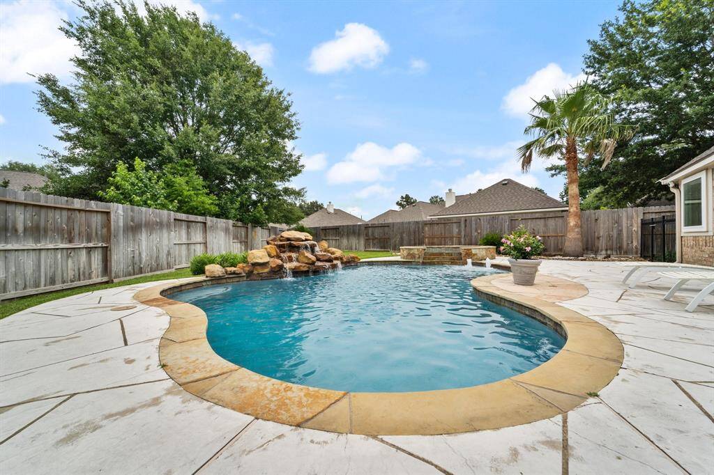 Beautiful outdoor oasis with pool, spa, rock and water features. Pool was replastered and re-tiled in 2023.