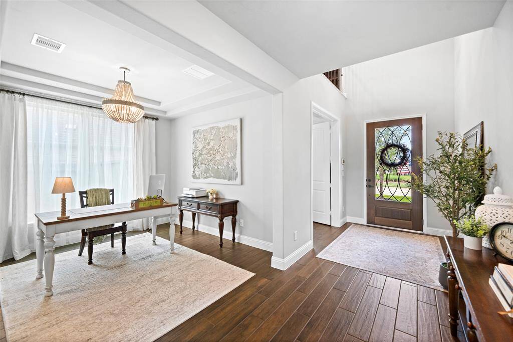 Entire 1st floor is tiled with dark wood-like ceramic tile.