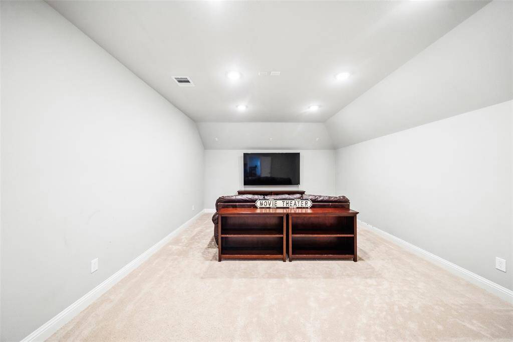 Texas-sized media room, the photo just can't show how big this one is! Between the game room and this room is a walk-in shelved storage closet and a separate niche with electrical outlet for your future snack bar addition!