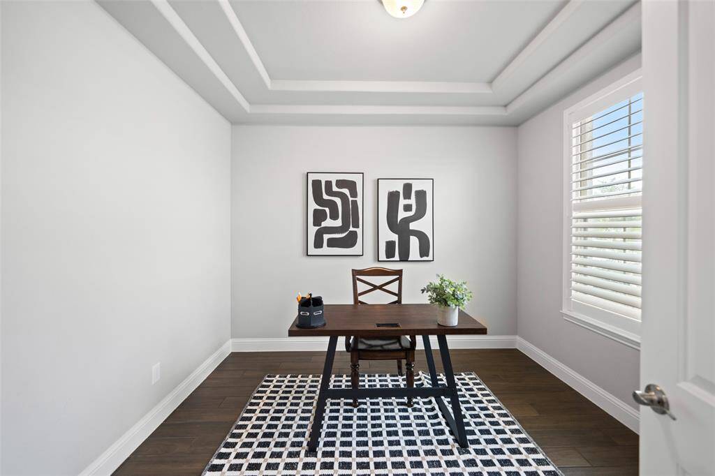 Home office is to the right as you enter the house. Privacy is ensured with a set of solid French doors and plantation shutters.