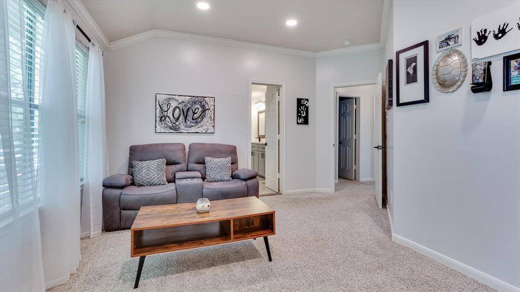 Plenty of space for a cozy private sitting area in the master bedroom.