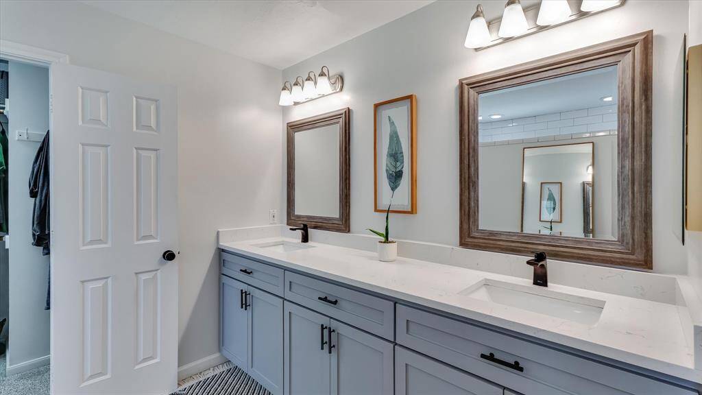 Tile shower opposite the vanity the full length of the wall! Plenty of room for two!!