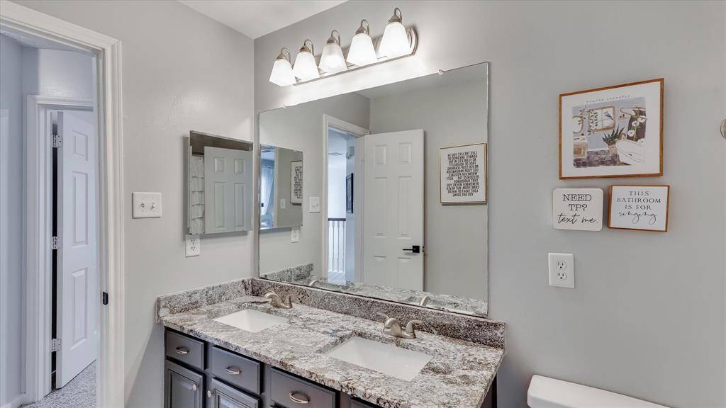 Hall bathroom updated with granite countertop.