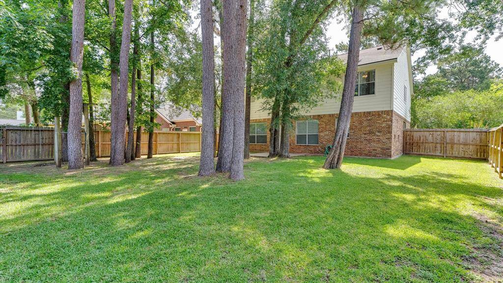 Plenty of green space to play and entertain in this backyard!