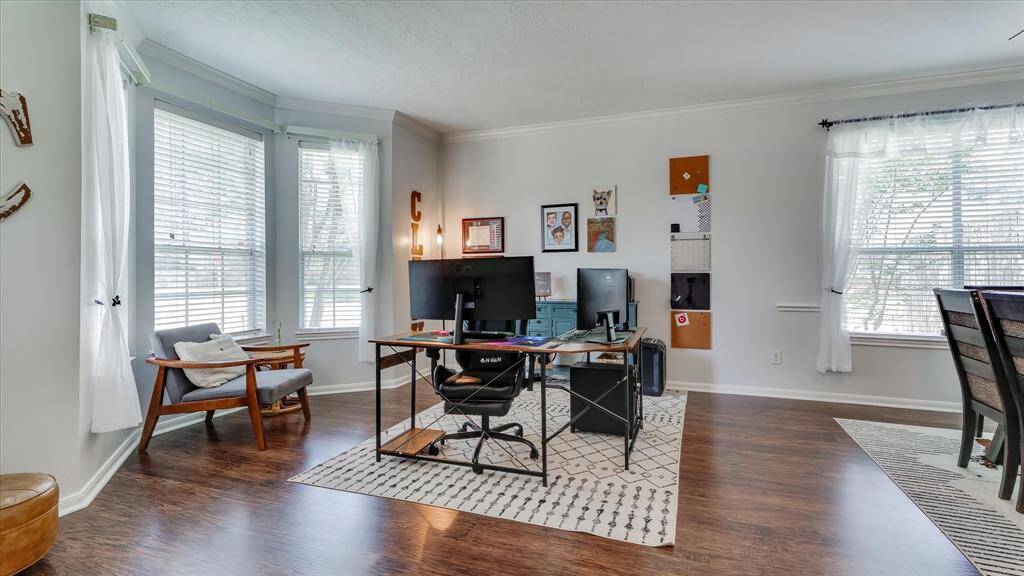 Front formal living area being used as an open office space.