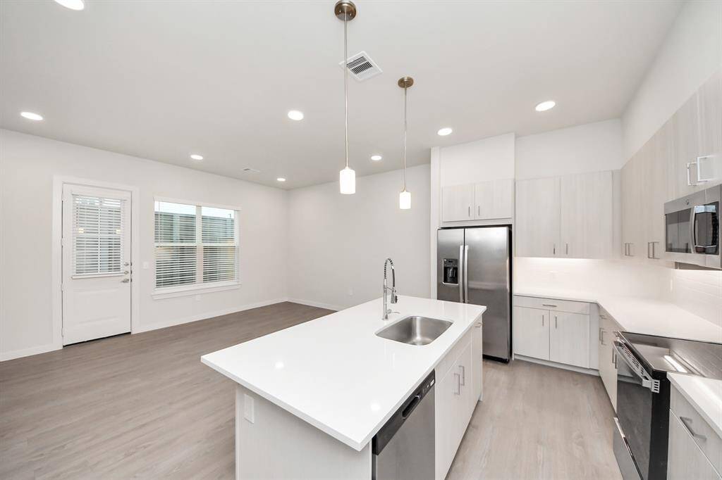 Stylish Island kitchens and open concept floor plans.! Boasting modern finishes, quartz counters, tile backsplash,stainless appliances,refrigerator,washer & dryer,walk-in pantries,walk-in closets,wood-like floors throughout,9ft ceilings.