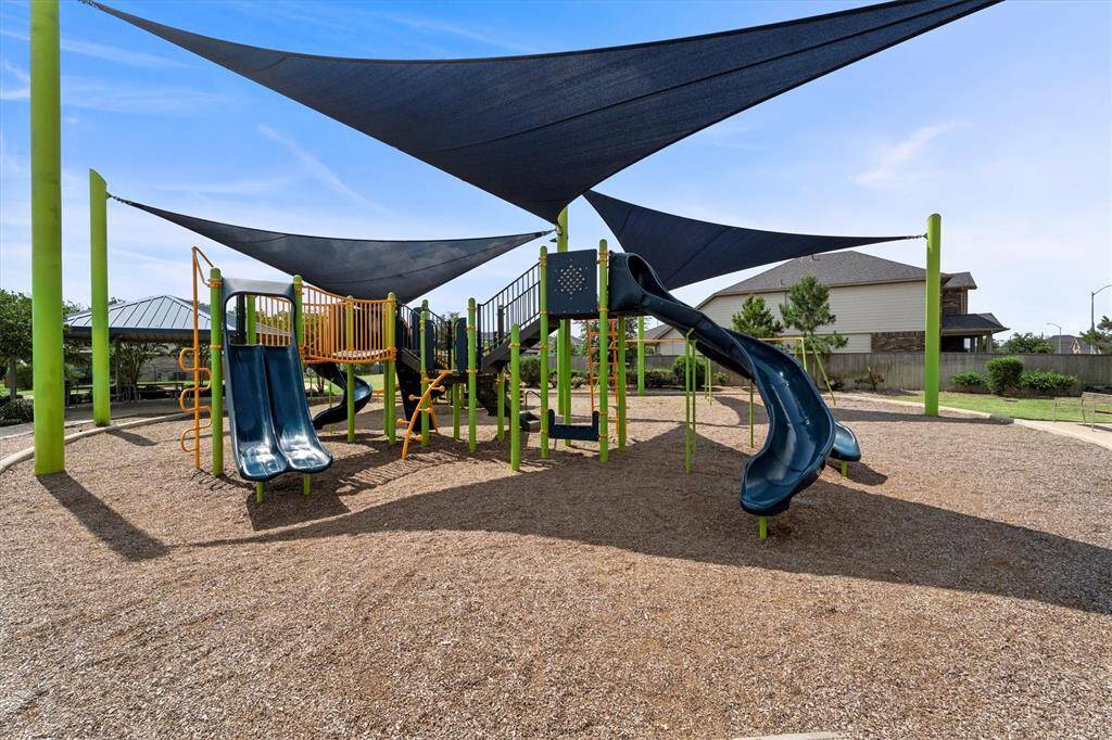 Another view of the subdivision park, you can see the covered picnic area in the background on the left.