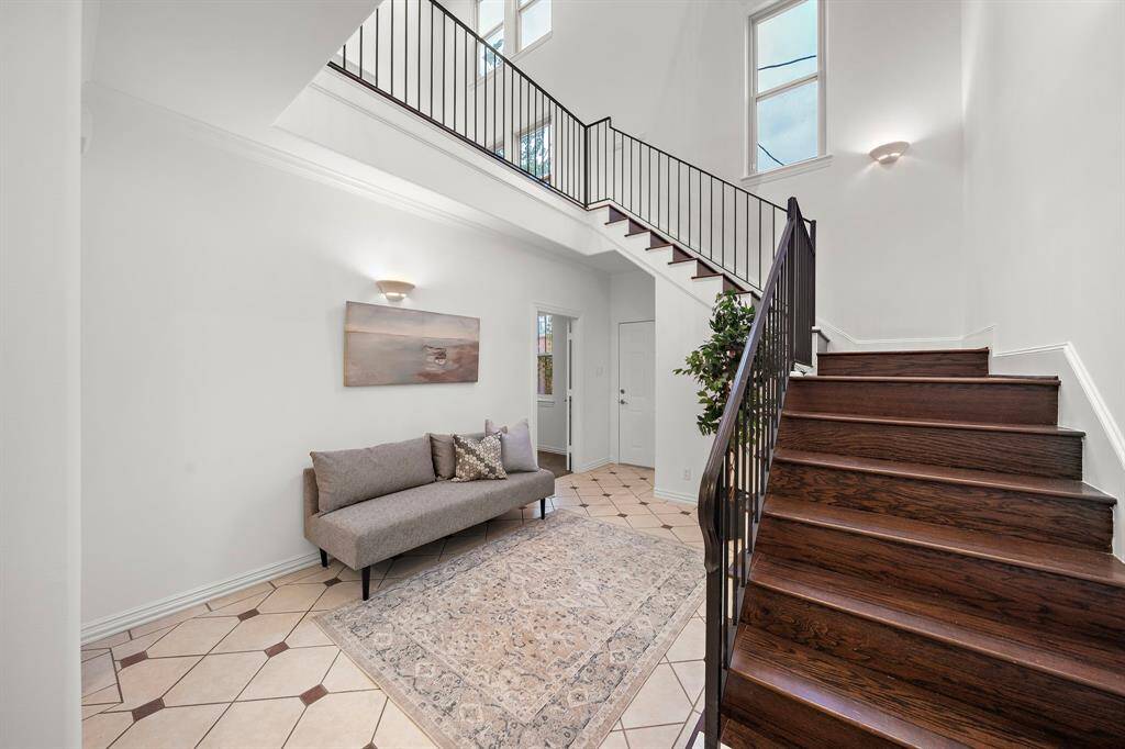Enter the home to a long foyer & a greeting area.