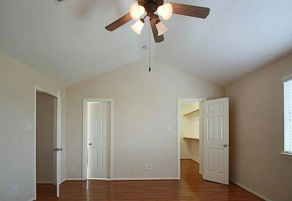 Primary bedroom with its own en suite bathroom and walk in closet.