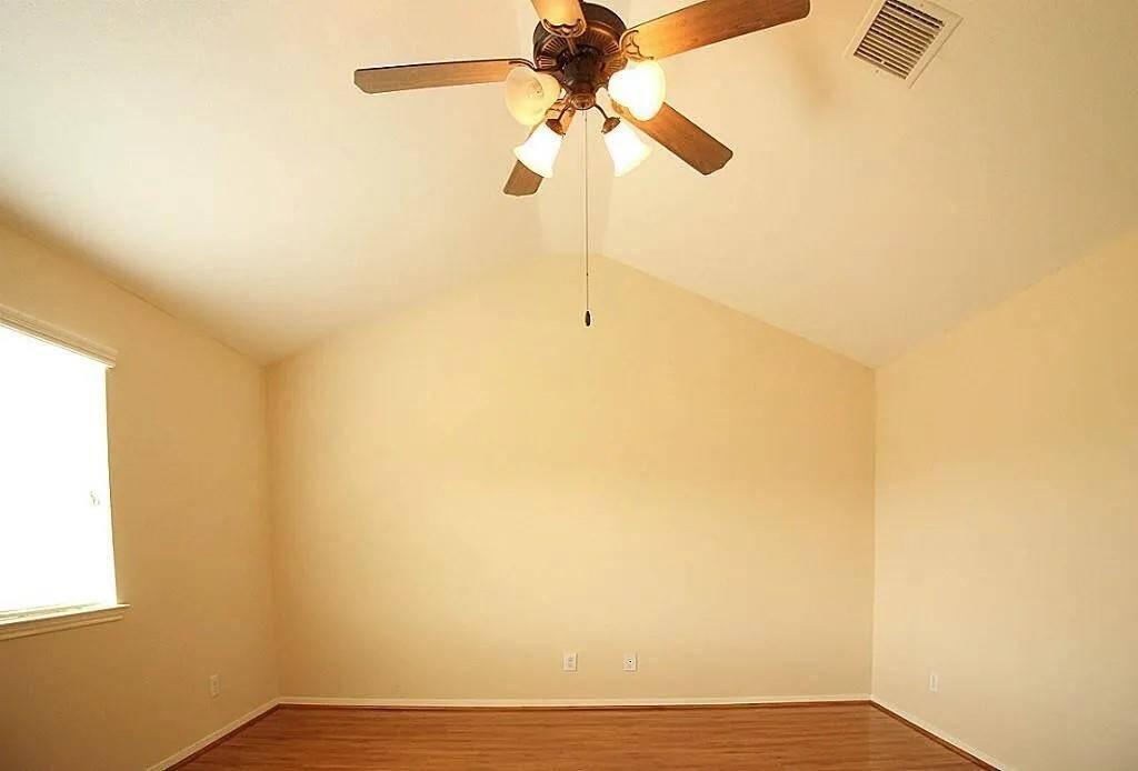 Another view of the primary bedroom
