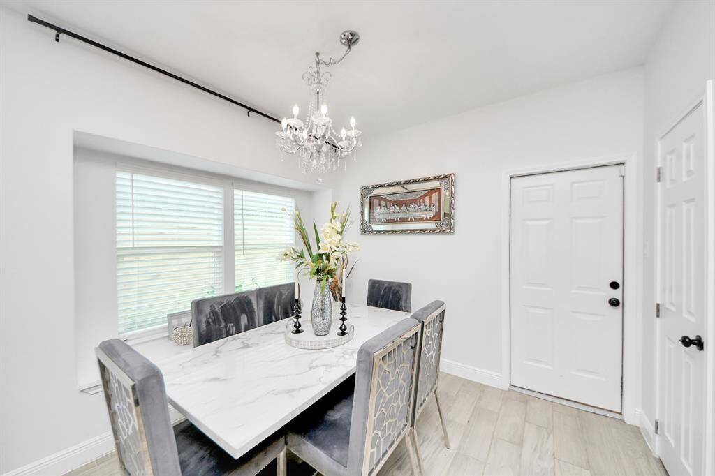 Dining room next to garage entryway.