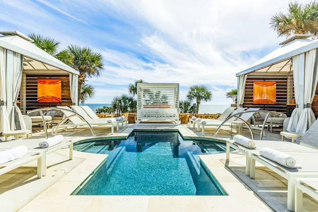 Relax in style- private poolside cabanas available upon request for ultimate comfort.