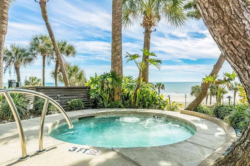 Unwind in the luxurious hot tub while soaking in breathtaking Gulf views.