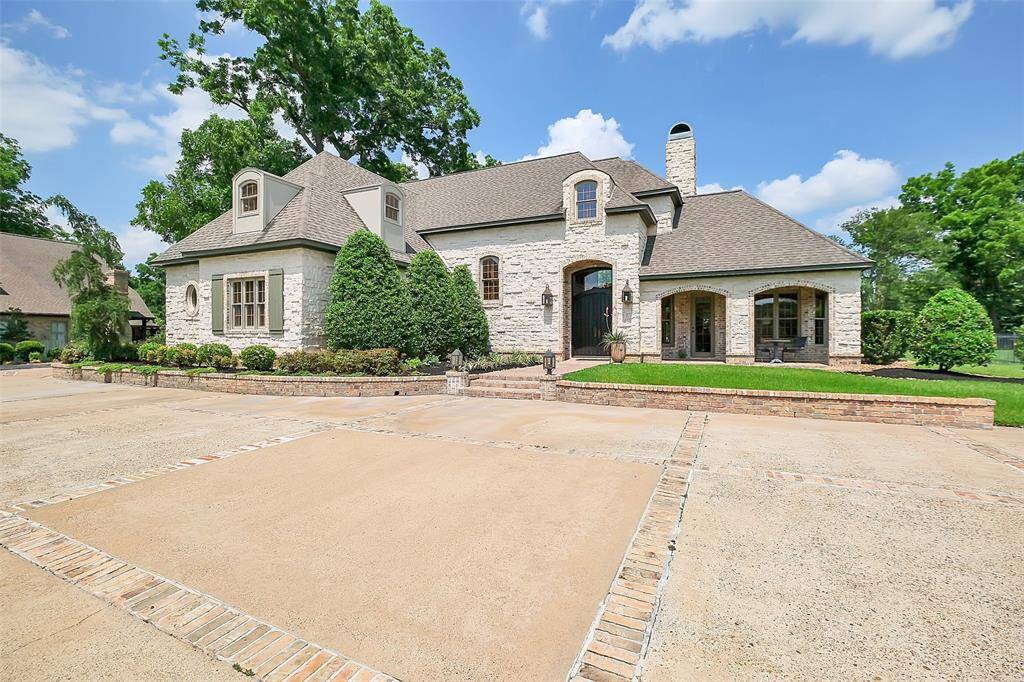 Welcome to a truly custom home at 5318 Westerham