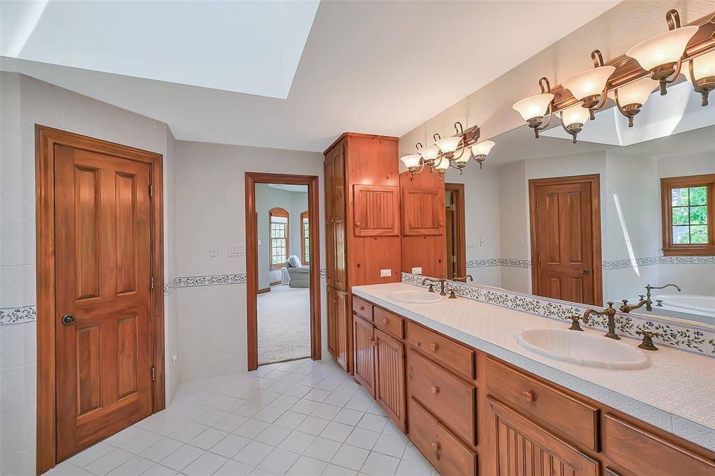 Primary bathroom with skylight that provides plenty of natural light