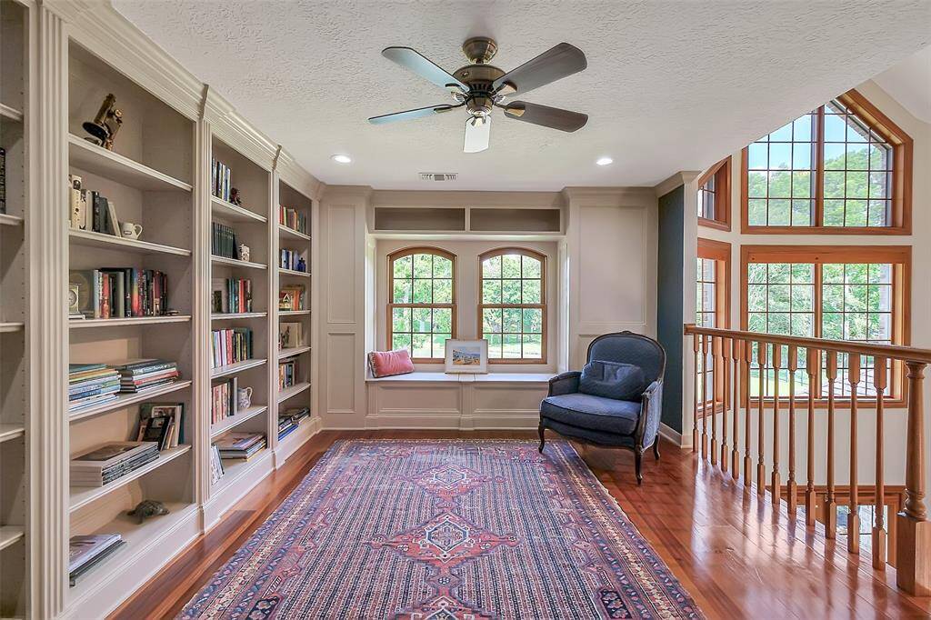 Cozy Library/Loft with all new custom shelving is a great place to enjoy your favorite book