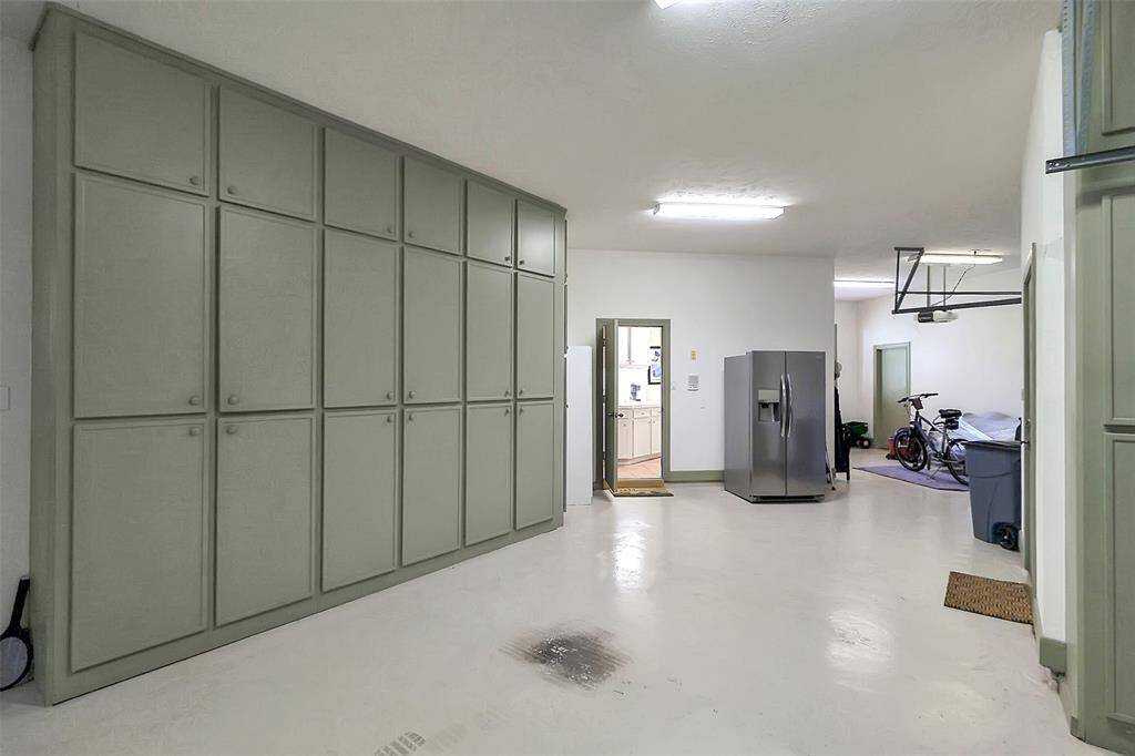 Look at all the storage in the oversized four-car garage
