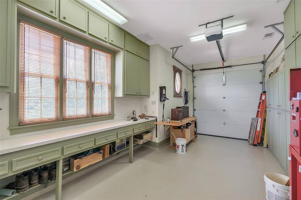 Fourth garage bay has been used as an air-conditioned workshop