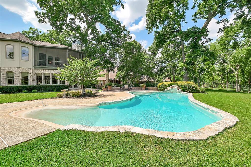 Another view of the large pool and spacious back yard