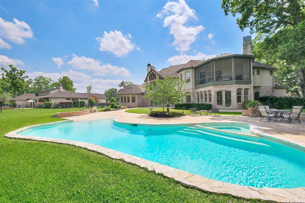 View of the pool and screened porch