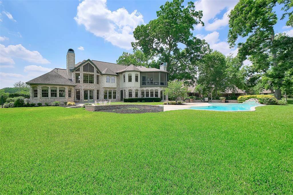 Look at the huge back yard on this acre+ lot