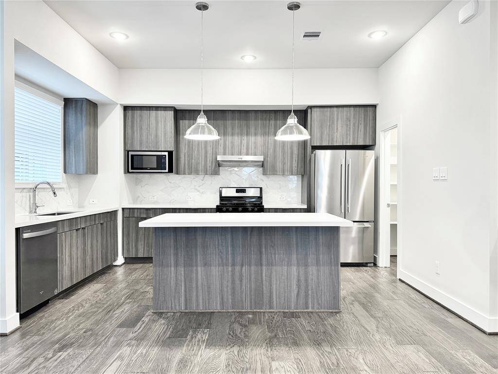 Second floor - Open concept kitchen & gas cooktop stove