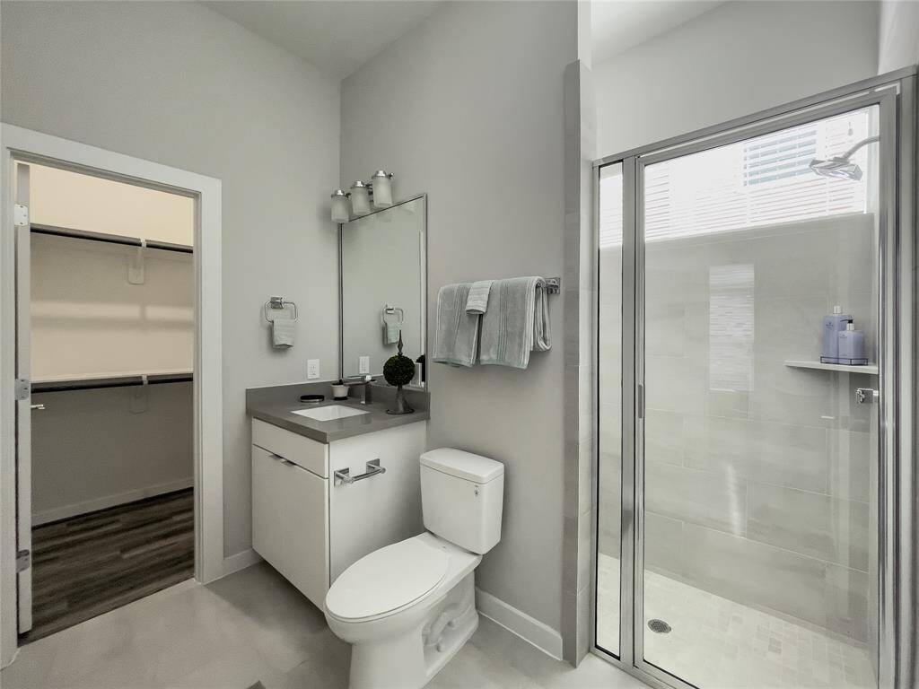 First floor - Bathroom with stand up shower and walk-in closet.