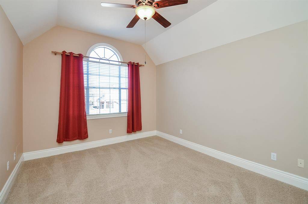 one of three secondary bedrooms