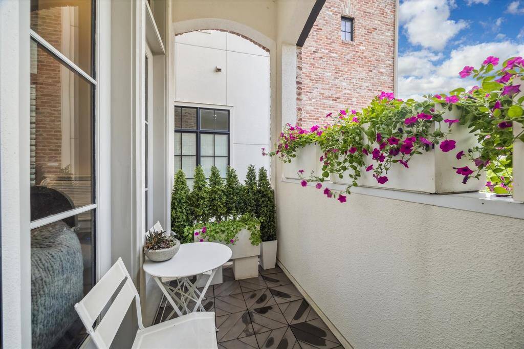 Accessed from the second-floor living area, this patio is a perfect spot to enjoy your morning coffee and affords privacy.  A screen door allows you to cast open those doors and enjoy our lovely Houston mornings!