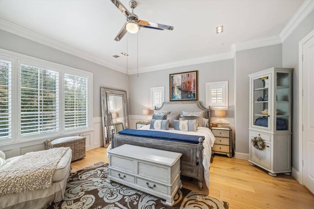 The third-floor primary suite offers a private retreat with treetop views, spacious design, and quiet comfort.