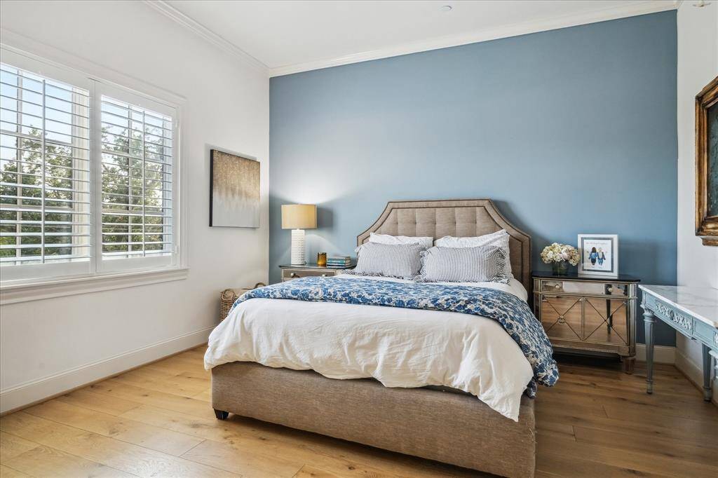 The fourth floor features an additional secondary bedroom with plenty of space and quiet comfort at the rear of the home.