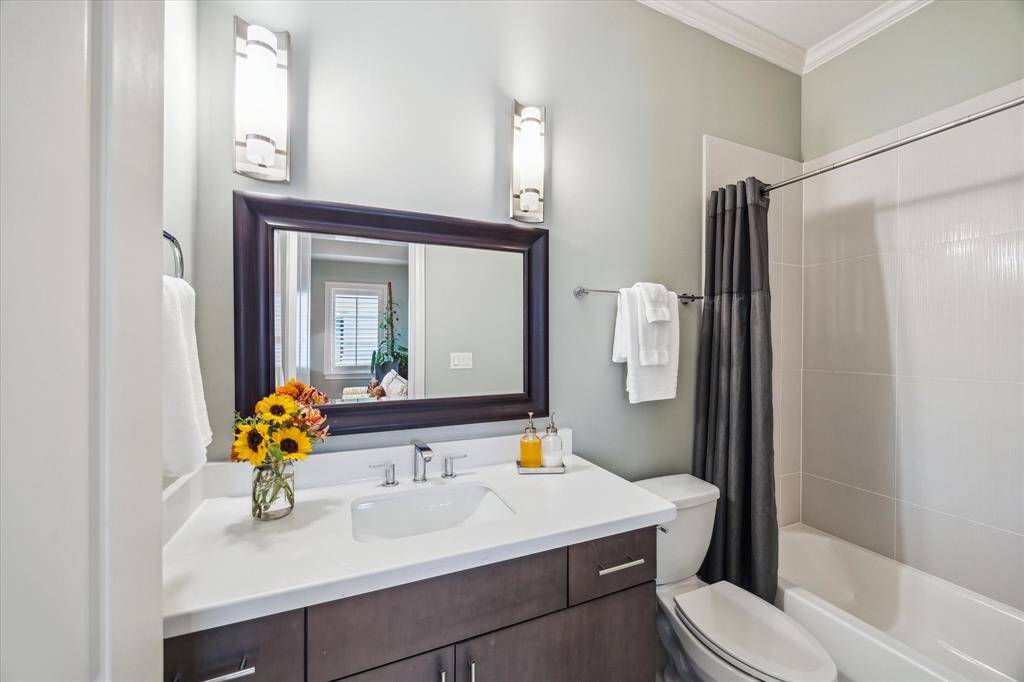 Another full secondary bathroom is located on the fourth floor, accessible to both the game room and the secondary bedroom.