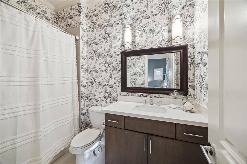 A full en-suite bath is attached to the first floor secondary bedroom.