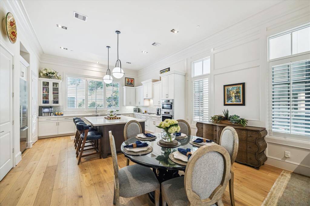 Gorgeous crown molding and custom millwork are highlighted on the second floor living, dining, and kitchen spaces.