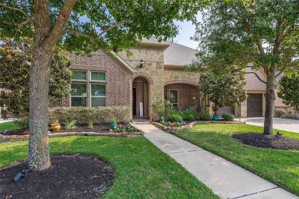 Charming brick home with beautifully landscaped lawn