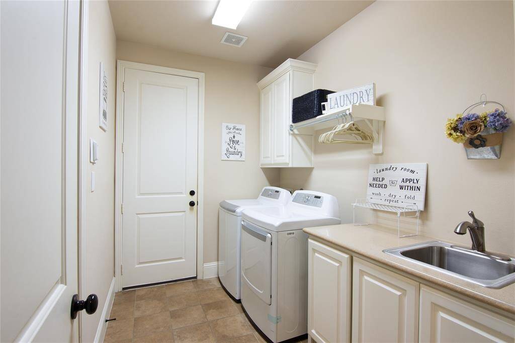 Walk right out of the primary closet into the utility room, makes doing laundry easy
